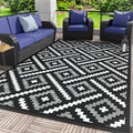 GENIMO Outdoor Rug for Patio Clearance, 6'x9' Waterproof Camping Mat, Reversible Plastic Straw Rugs for RV, Camper, Balcony, Backyard, Picnic, Deck (Mix Black White)